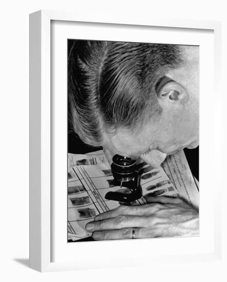 Police Investigator Examining a Set of Fingerprints-Carl Mydans-Framed Photographic Print