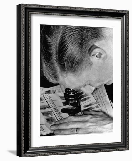 Police Investigator Examining a Set of Fingerprints-Carl Mydans-Framed Photographic Print