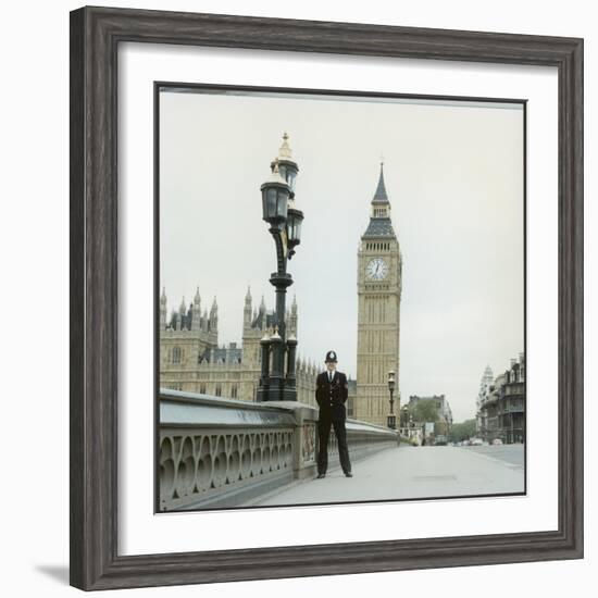 Police Officer on Duty on Westminster Bridge by Big Ben, London. Metropolitan Police-null-Framed Photographic Print