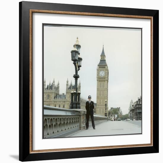 Police Officer on Duty on Westminster Bridge by Big Ben, London. Metropolitan Police-null-Framed Photographic Print