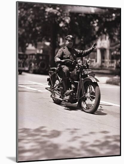 Police Officer on Motorcycle-Philip Gendreau-Mounted Photographic Print