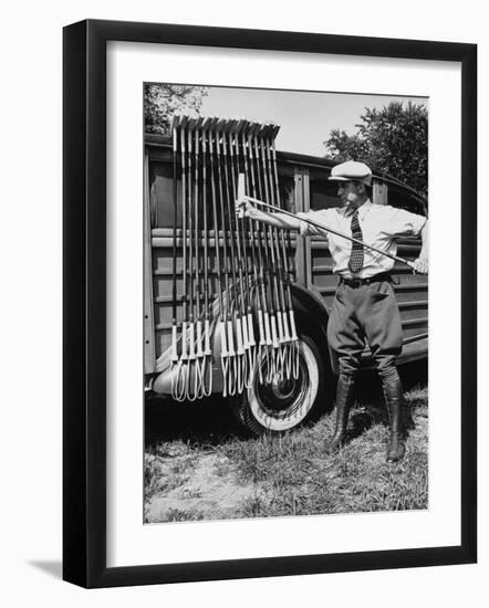 Polo Player Checking the Mallets-Alfred Eisenstaedt-Framed Photographic Print