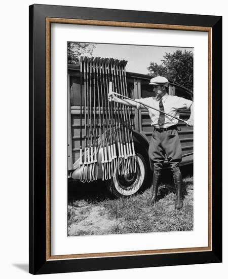 Polo Player Checking the Mallets-Alfred Eisenstaedt-Framed Photographic Print