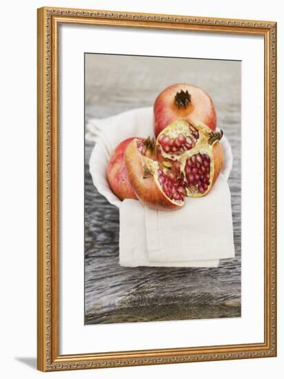 Pomegranate, Whole and Halved, on Cloth in White Bowl-Foodcollection-Framed Photographic Print