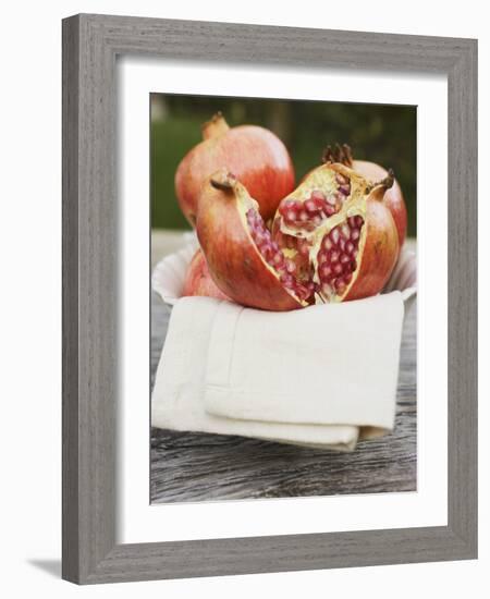 Pomegranates, Whole and Halved, on Cloth in White Bowl-null-Framed Photographic Print
