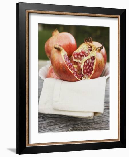 Pomegranates, Whole and Halved, on Cloth in White Bowl-null-Framed Photographic Print