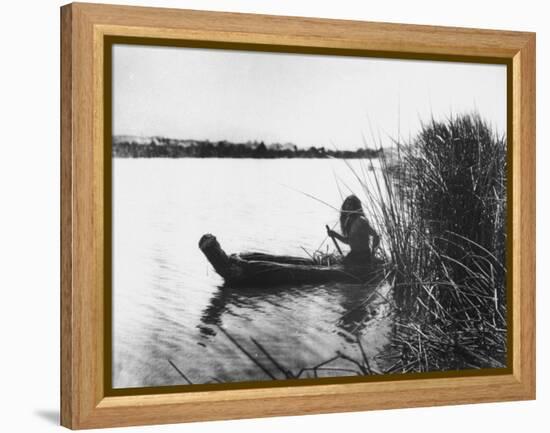Pomo Indian Poling His Boat Made of Tule Rushes Through Shallows of Clear Lake, Northen California-Edward S^ Curtis-Framed Premier Image Canvas