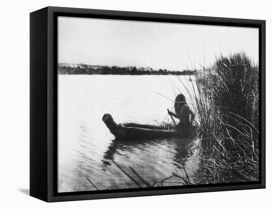 Pomo Indian Poling His Boat Made of Tule Rushes Through Shallows of Clear Lake, Northen California-Edward S^ Curtis-Framed Premier Image Canvas