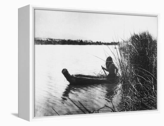 Pomo Indian Poling His Boat Made of Tule Rushes Through Shallows of Clear Lake, Northen California-Edward S^ Curtis-Framed Premier Image Canvas