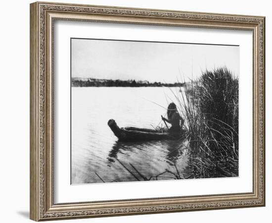 Pomo Indian Poling His Boat Made of Tule Rushes Through Shallows of Clear Lake, Northen California-Edward S^ Curtis-Framed Photographic Print