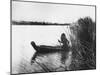 Pomo Indian Poling His Boat Made of Tule Rushes Through Shallows of Clear Lake, Northen California-Edward S^ Curtis-Mounted Photographic Print