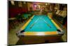 Pool table lit by electric lights in a restaurant and bar in Shoshone, CA near Death Valley Nati...-null-Mounted Photographic Print