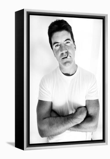 Pop Idol Judge Simon Cowell Poses Smoking a Cigarette at Max Clifford's Office London-null-Framed Premier Image Canvas