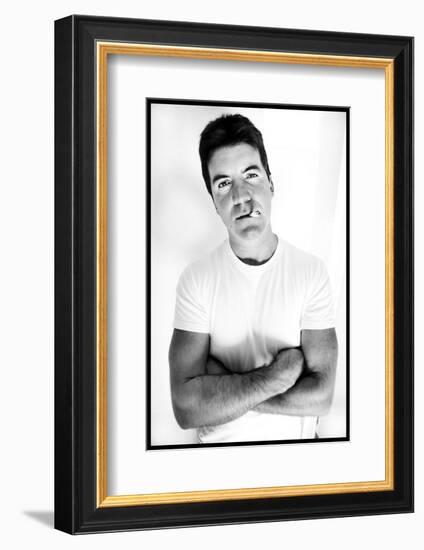 Pop Idol Judge Simon Cowell Poses Smoking a Cigarette at Max Clifford's Office London-null-Framed Photographic Print