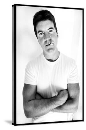 simon cowell cigarette Pop Idol Judge Simon Cowell Poses Smoking a Cigarette at Max Clifford's  Office London Premium Photographic Print