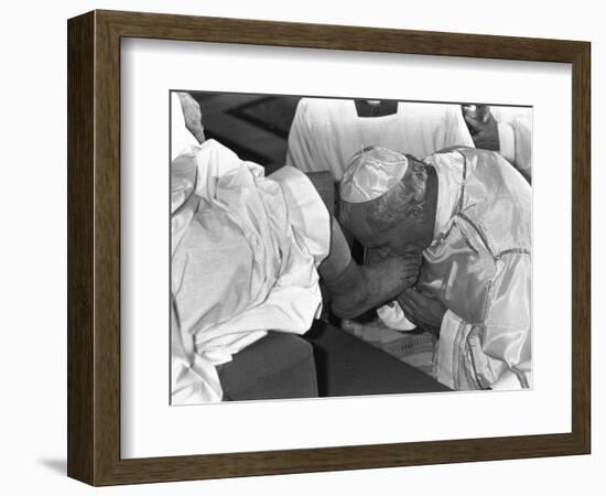 Pope John Paul II Kisses the Feet of One of 12 Mentally Retarded Italians-null-Framed Photographic Print