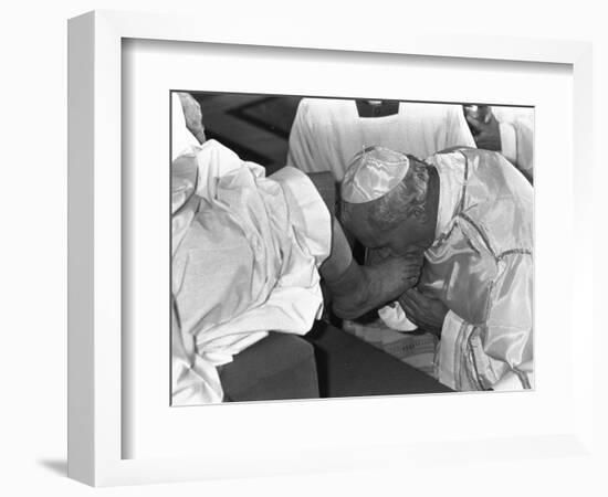 Pope John Paul II Kisses the Feet of One of 12 Mentally Retarded Italians-null-Framed Photographic Print