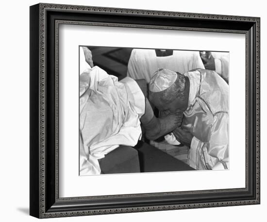 Pope John Paul II Kisses the Feet of One of 12 Mentally Retarded Italians-null-Framed Photographic Print