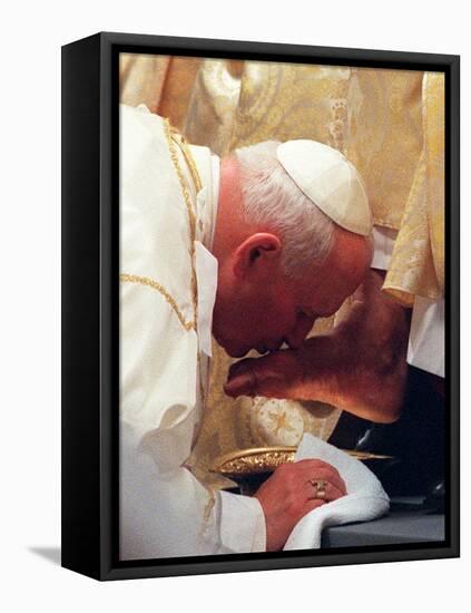 Pope John Paul II Kisses the Foot of a Clergyman-null-Framed Premier Image Canvas