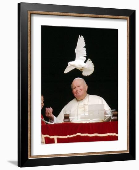 Pope John Paul II Looks at a White Dove After the Angelus Prayer in St. Peter's Square, at Vatican-null-Framed Photographic Print