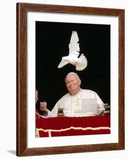 Pope John Paul II Looks at a White Dove After the Angelus Prayer in St. Peter's Square, at Vatican-null-Framed Photographic Print