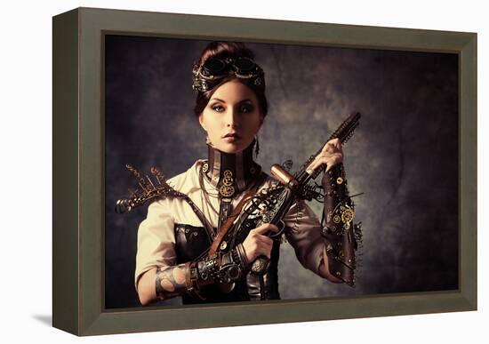 Portrait Of A Beautiful Steampunk Woman Holding A Gun Over Grunge Background-prometeus-Framed Stretched Canvas