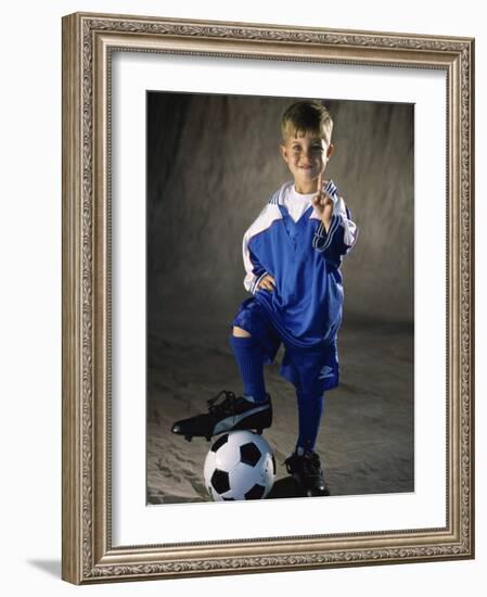 Portrait of a Boy Standing with His Foot on a Soccer Ball-null-Framed Photographic Print