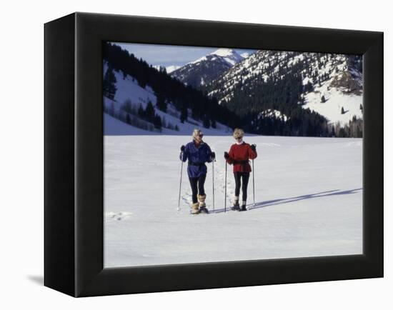 Portrait of a Senior Woman and a Young Woman Standing Wearing Skis-null-Framed Premier Image Canvas