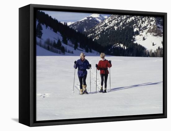 Portrait of a Senior Woman and a Young Woman Standing Wearing Skis-null-Framed Premier Image Canvas