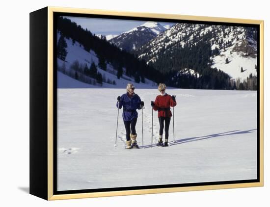 Portrait of a Senior Woman and a Young Woman Standing Wearing Skis-null-Framed Premier Image Canvas