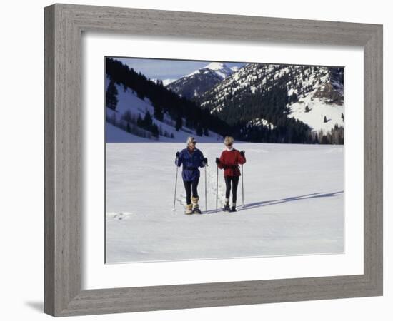 Portrait of a Senior Woman and a Young Woman Standing Wearing Skis-null-Framed Photographic Print