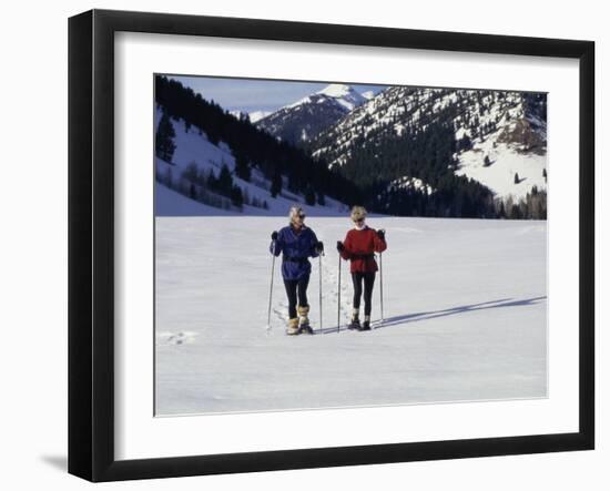 Portrait of a Senior Woman and a Young Woman Standing Wearing Skis-null-Framed Photographic Print