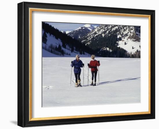 Portrait of a Senior Woman and a Young Woman Standing Wearing Skis-null-Framed Photographic Print