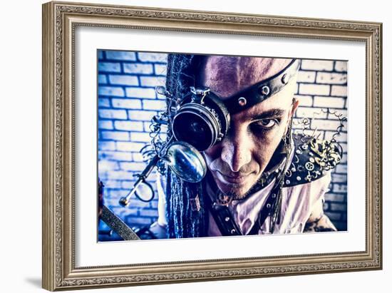 Portrait Of A Steampunk Man With A Mechanical Devices Over Brick Wall-prometeus-Framed Art Print