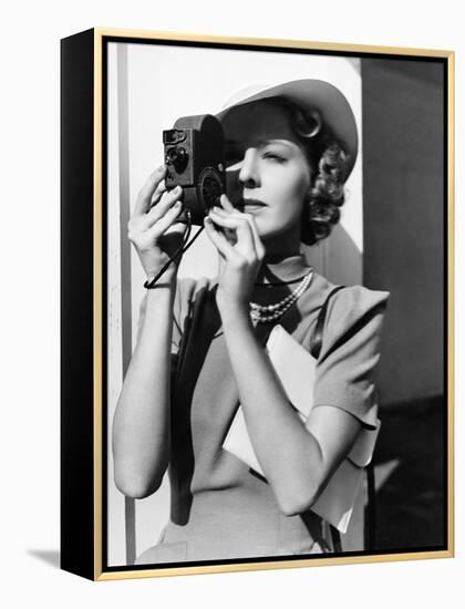 Portrait of a Young Woman Taking a Picture with a Camera-Everett Collection-Framed Premier Image Canvas