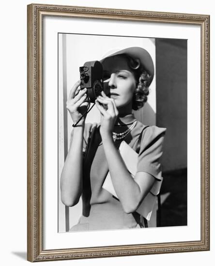 Portrait of a Young Woman Taking a Picture with a Camera-Everett Collection-Framed Photographic Print