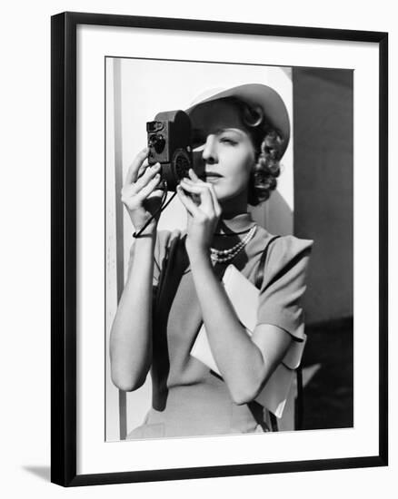 Portrait of a Young Woman Taking a Picture with a Camera-Everett Collection-Framed Photographic Print