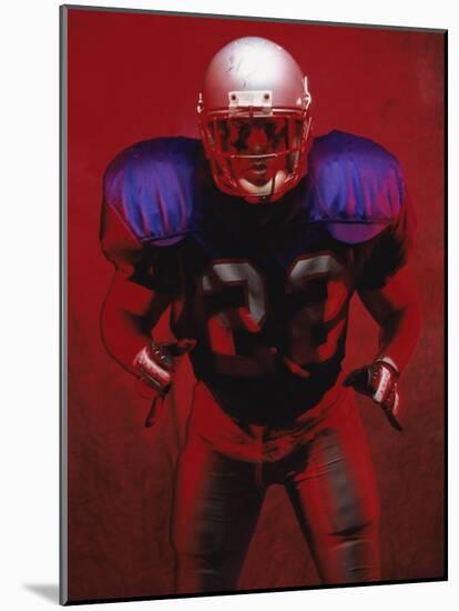 Portrait of an American Football Player Standing in a Tackle Pose-null-Mounted Photographic Print