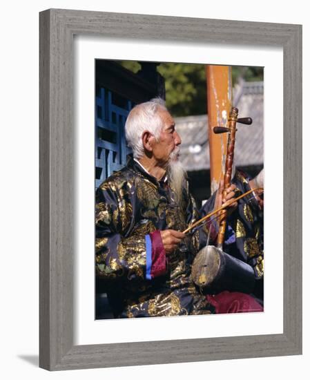 Portrait of an Elderly Musician from the Naxi Orchestra Practising by the Black Dragon Pool, China-Doug Traverso-Framed Photographic Print