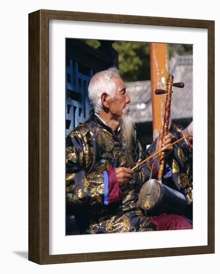 Portrait of an Elderly Musician from the Naxi Orchestra Practising by the Black Dragon Pool, China-Doug Traverso-Framed Photographic Print