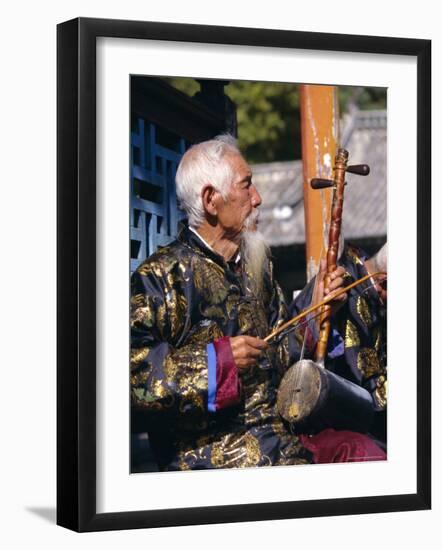 Portrait of an Elderly Musician from the Naxi Orchestra Practising by the Black Dragon Pool, China-Doug Traverso-Framed Photographic Print