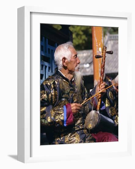 Portrait of an Elderly Musician from the Naxi Orchestra Practising by the Black Dragon Pool, China-Doug Traverso-Framed Photographic Print