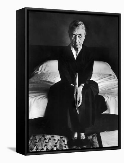 Portrait of Artist Georgia O'Keeffe Holding a Book by Leonard Baskinin Her Bedroom-John Loengard-Framed Premier Image Canvas