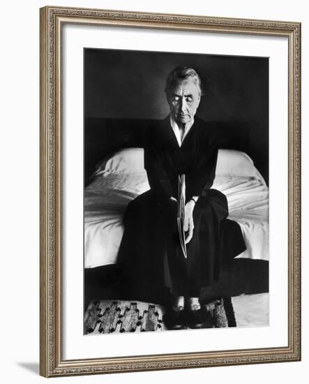 Portrait of Artist Georgia O'Keeffe Holding a Book by Leonard Baskinin Her Bedroom-John Loengard-Framed Premium Photographic Print