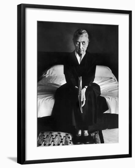 Portrait of Artist Georgia O'Keeffe Holding a Book by Leonard Baskinin Her Bedroom-John Loengard-Framed Premium Photographic Print