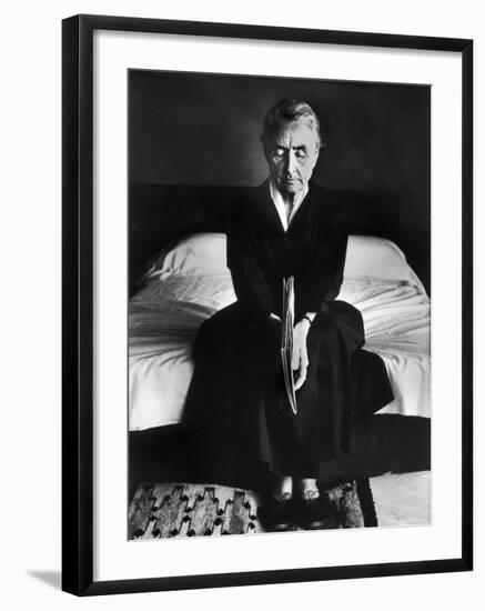 Portrait of Artist Georgia O'Keeffe Holding a Book by Leonard Baskinin Her Bedroom-John Loengard-Framed Premium Photographic Print