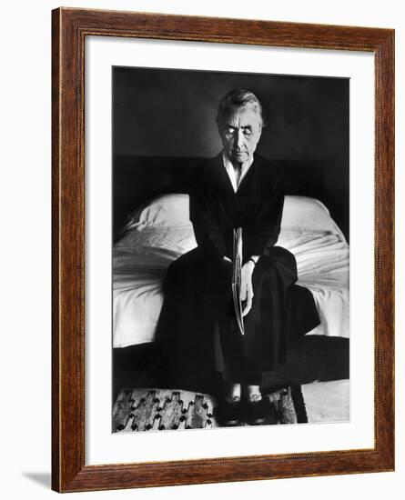 Portrait of Artist Georgia O'Keeffe Holding a Book by Leonard Baskinin Her Bedroom-John Loengard-Framed Premium Photographic Print