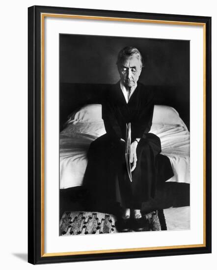 Portrait of Artist Georgia O'Keeffe Holding a Book by Leonard Baskinin Her Bedroom-John Loengard-Framed Premium Photographic Print