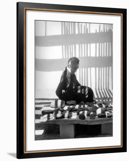 Portrait of Artist Georgia O'Keeffe Sitting Among Rock Collection-John Loengard-Framed Premium Photographic Print