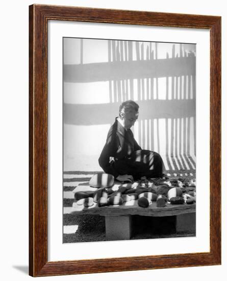 Portrait of Artist Georgia O'Keeffe Sitting Among Rock Collection-John Loengard-Framed Premium Photographic Print